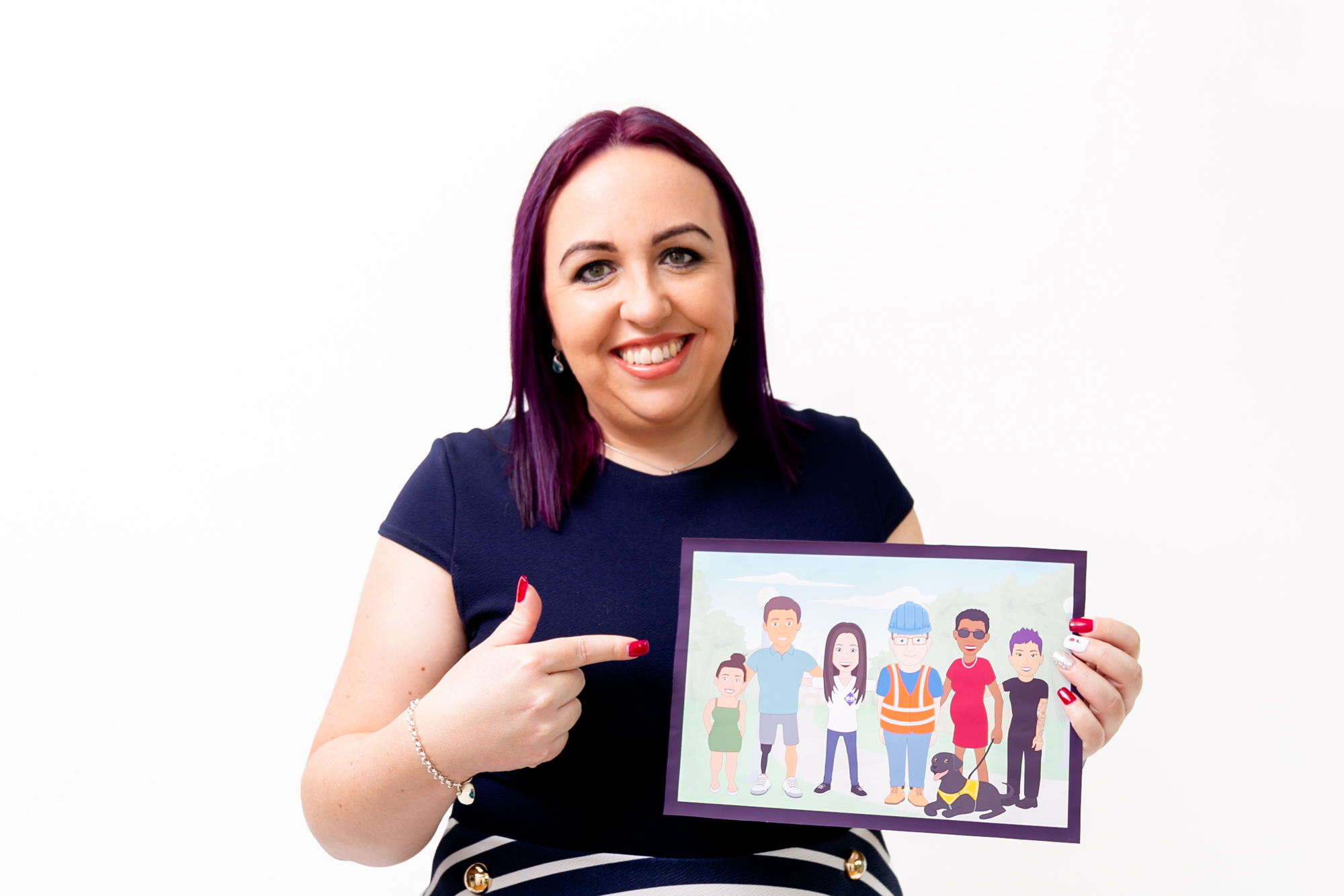 Jodie Greer smiling holding picture of disabled people. Wearing purple top and stripey purple skirt